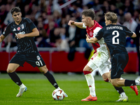 AFC Ajax Amsterdam forward Mika Godts and Besiktas JK defender Jonas Svensson during the match between Ajax and Besiktas at the Johan Cruijf...