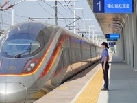 A staff member receives and departs a train on the platform at Fushan Station in Yantai, China, on September 27, 2024. As of September 14, 2...