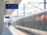 A staff member receives and departs a train on the platform at Fushan Station in Yantai, China, on September 27, 2024. As of September 14, 2...