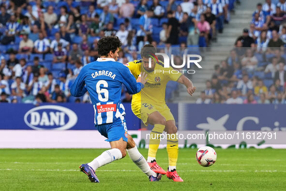 Leandro Cabrera of Espanyol challenges Sergi Cardona of Villarreal for the ball during the La Liga EA SPORTS match at Stage Front Stadium, i...