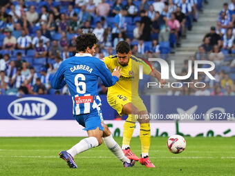 Leandro Cabrera of Espanyol challenges Sergi Cardona of Villarreal for the ball during the La Liga EA SPORTS match at Stage Front Stadium, i...