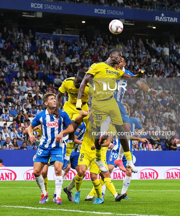 Thierno Barry of Villarreal leaps for a header against Walid Cheddira of Espanyol during the La Liga EA SPORTS match at Stage Front Stadium,...