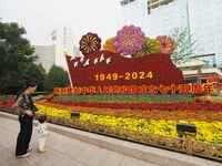 National Day themed flower beds are displayed along Chang'an Avenue in Beijing, China, on September 27, 2024. (