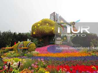 National Day themed flower beds are displayed along Chang'an Avenue in Beijing, China, on September 27, 2024. (