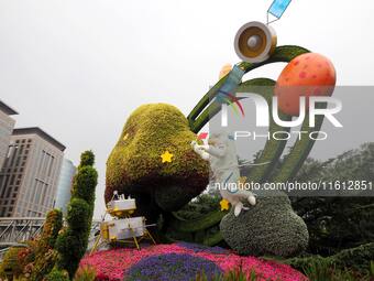 National Day themed flower beds are displayed along Chang'an Avenue in Beijing, China, on September 27, 2024. (