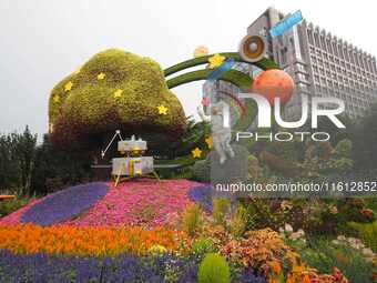 National Day themed flower beds are displayed along Chang'an Avenue in Beijing, China, on September 27, 2024. (