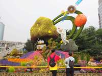 National Day themed flower beds are displayed along Chang'an Avenue in Beijing, China, on September 27, 2024. (