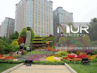 National Day themed flower beds are displayed along Chang'an Avenue in Beijing, China, on September 27, 2024. (