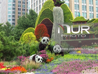 National Day themed flower beds are displayed along Chang'an Avenue in Beijing, China, on September 27, 2024. (