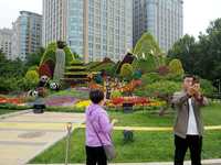 National Day themed flower beds are displayed along Chang'an Avenue in Beijing, China, on September 27, 2024. (