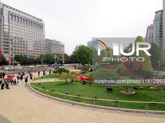 National Day themed flower beds are displayed along Chang'an Avenue in Beijing, China, on September 27, 2024. (