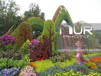 National Day themed flower beds are displayed along Chang'an Avenue in Beijing, China, on September 27, 2024. (