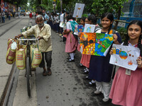 Students display their paintings dedicated to the protection of the global climate during a protest demonstration on Global Climate Strike 2...