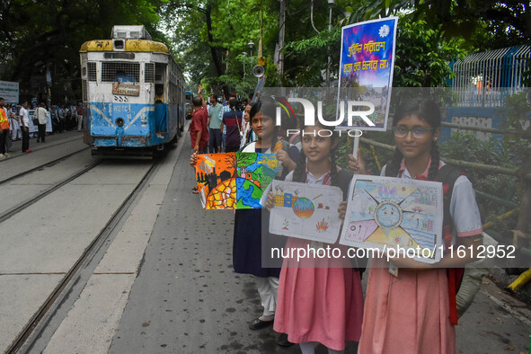 Students display their paintings dedicated to the protection of the global climate during a protest demonstration on Global Climate Strike 2...