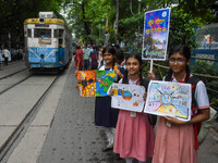 Students display their paintings dedicated to the protection of the global climate during a protest demonstration on Global Climate Strike 2...