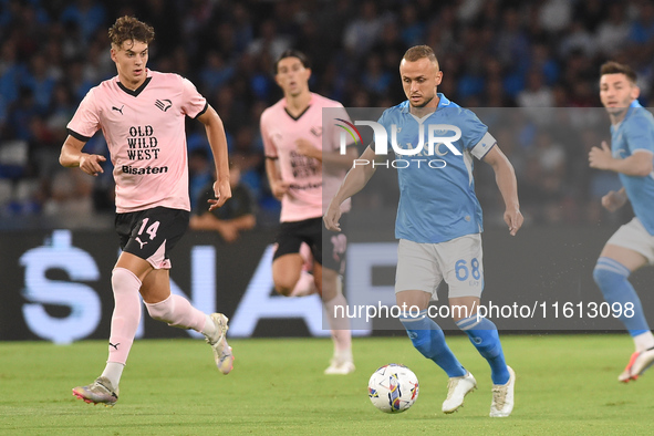 Aljosa Vasic of Palermo FC competes for the ball with Stanislav Lobotka of SSC Napoli during the Coppa Italia match between SSC Napoli and P...