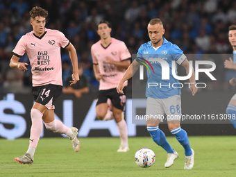 Aljosa Vasic of Palermo FC competes for the ball with Stanislav Lobotka of SSC Napoli during the Coppa Italia match between SSC Napoli and P...