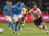 Jeremy Le Douaron of Palermo FC competes for the ball with Juan Jesus of SSC Napoli during the Coppa Italia match between SSC Napoli and Pal...