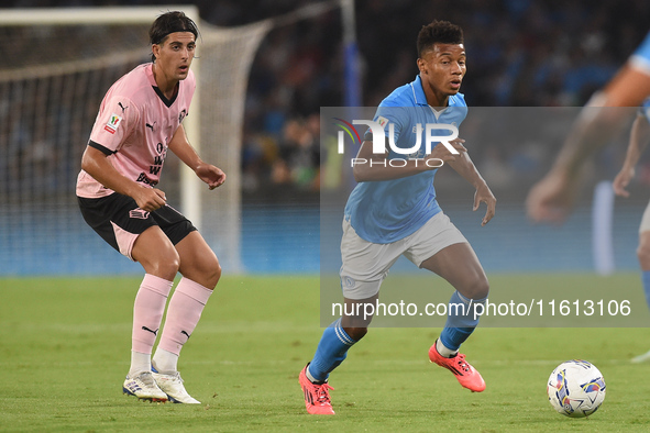 Filippo Ranocchia of Palermo FC competes for the ball with David Neres of SSC Napoli during the Coppa Italia match between SSC Napoli and Pa...