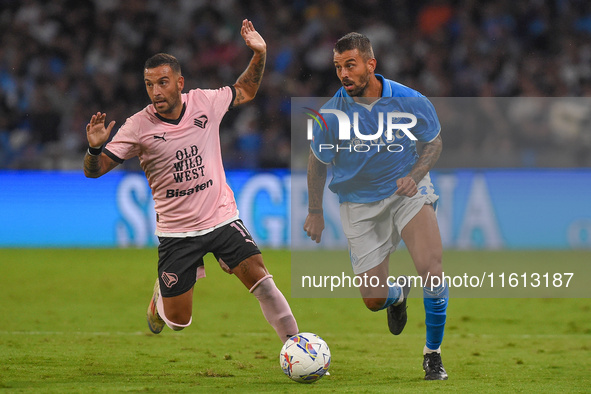 Roberto Insigne of Palermo FC competes for the ball with Leonardo Spinazzola of SSC Napoli during the Coppa Italia match between SSC Napoli...