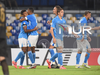 David Neres of SSC Napoli celebrates with team mates after scoring during the Coppa Italia match between SSC Napoli and Palermo FC at Stadio...