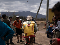 Brigade members from the San Isabel neighborhood, just a few kilometers from downtown Capilla del Monte, prepare to combat the few remaining...