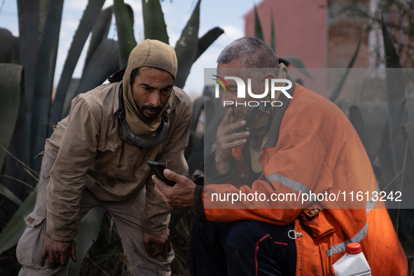 Brigade members from the San Isabel neighborhood, just a few kilometers from downtown Capilla del Monte, prepare to combat the few remaining...