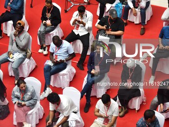 Foreign businessmen attend the opening ceremony of the 17th China Handan (Yongnian) Fastener and Equipment Exhibition in Handan, China, on S...