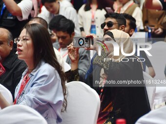 Foreign businessmen attend the opening ceremony of the 17th China Handan (Yongnian) Fastener and Equipment Exhibition in Handan, China, on S...