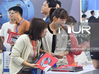 Buyers shop at the 17th China Handan (Yongnian) Fasteners and Equipment Exhibition in Handan, China, on September 26, 2024. (