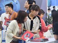 Buyers shop at the 17th China Handan (Yongnian) Fasteners and Equipment Exhibition in Handan, China, on September 26, 2024. (