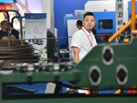 Buyers shop for production equipment at the 17th China Handan (Yongnian) Fasteners and Equipment Exhibition in Handan, China, on September 2...