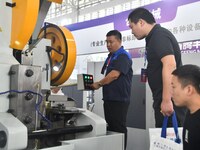 Buyers shop for production equipment at the 17th China Handan (Yongnian) Fasteners and Equipment Exhibition in Handan, China, on September 2...