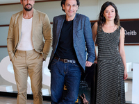 Anna Castillo, Mario Casas, and Rodrigo Cortes attend the photocall for ''Escape'' during the 72nd San Sebastian International Film Festival...