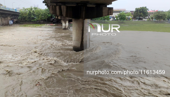 The water level of the Mahananda River rises during continuous rainfall in Siliguri, India, on September 27, 2024. 