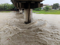 The water level of the Mahananda River rises during continuous rainfall in Siliguri, India, on September 27, 2024. (