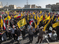 Iranian worshippers wave Lebanon's Hezbollah flags while taking part in an anti-Israeli protest to condemn Israel's military attack on Leban...