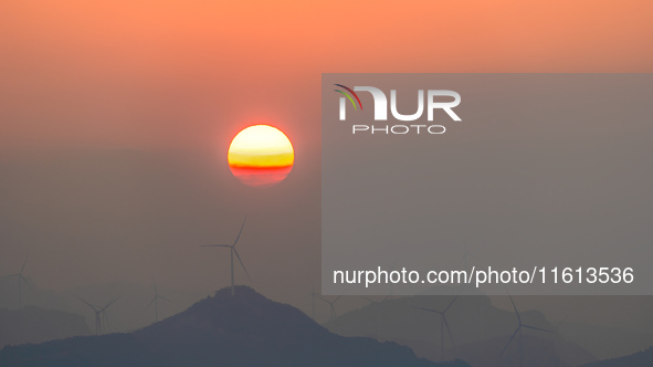 The photo shows the sunrise at Yonglongshan Forest Park in Chongqing, China, on September 27, 2024. 