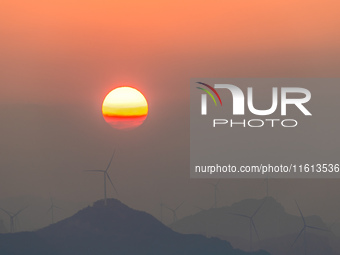 The photo shows the sunrise at Yonglongshan Forest Park in Chongqing, China, on September 27, 2024. (