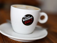 Caffe Vergnano logo is seen on a cup of cappucino in this illustration photo taken at a cafe in Krakow, Poland on September 26, 2024. (