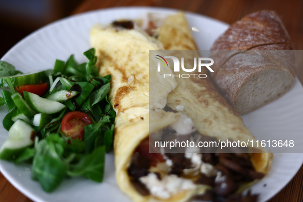 An omelette with goat cheese, beacon and mushrooms is seen in this illustration photo taken in a cafe Krakow, Poland on September 26, 2024. 