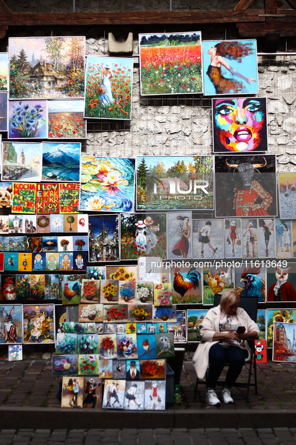 A view of the street gallery with paintings in Krakow in Krakow, Poland on September 26, 2024. 