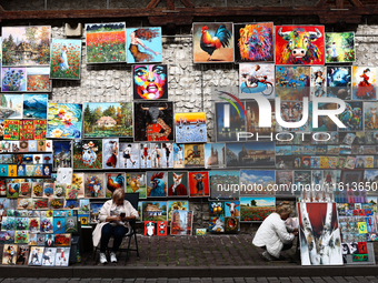 A view of the street gallery with paintings in Krakow in Krakow, Poland on September 26, 2024. (