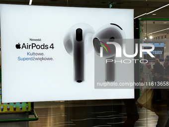 Apple AirPods 4 ad is seen on a store in Krakow, Poland on September 26, 2024. (