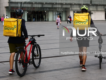 Glovo couriers are seen in Krakow, Poland on September 26, 2024. (