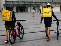 Glovo couriers are seen in Krakow, Poland on September 26, 2024. (