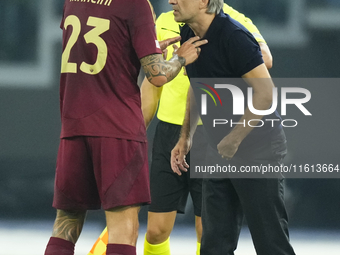 Ivan Juric head coach of Roma and Gianluca Mancini centre-back of Roma and Italy talks during the UEFA Europa League 2024/25 League Phase MD...