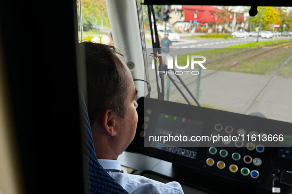 A tram operator drives a tram in Krakow, Poland on September 26, 2024. 