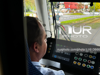 A tram operator drives a tram in Krakow, Poland on September 26, 2024. (