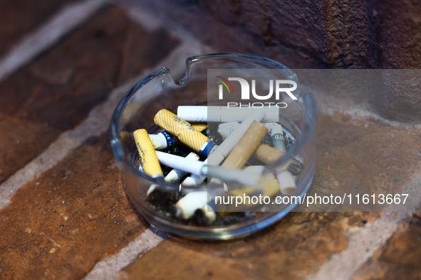 Cigarette butts are seen in the ashtray in Krakow, Poland on September 26, 2024. 